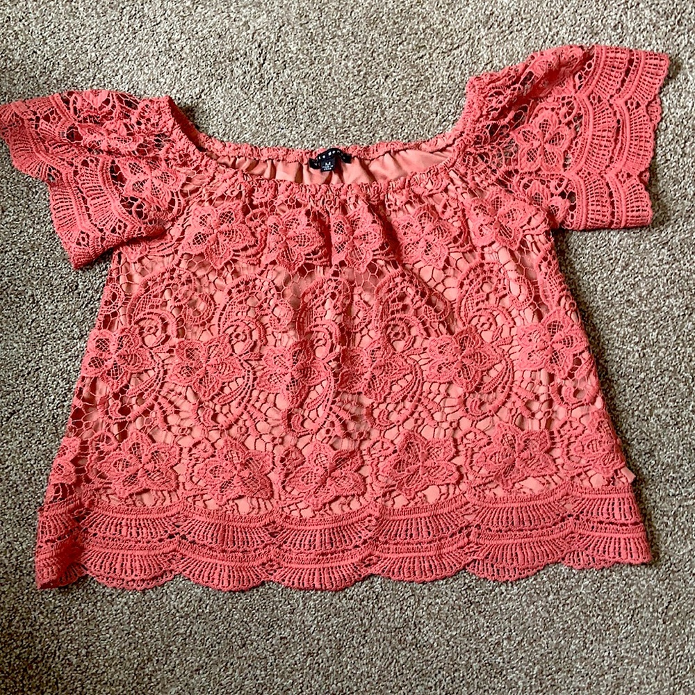 Coral colored knitted-look top